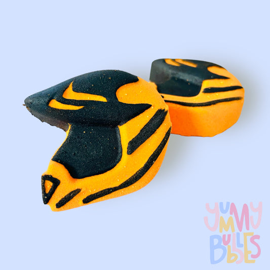 Orange helmet shaped bath bomb painted with black
