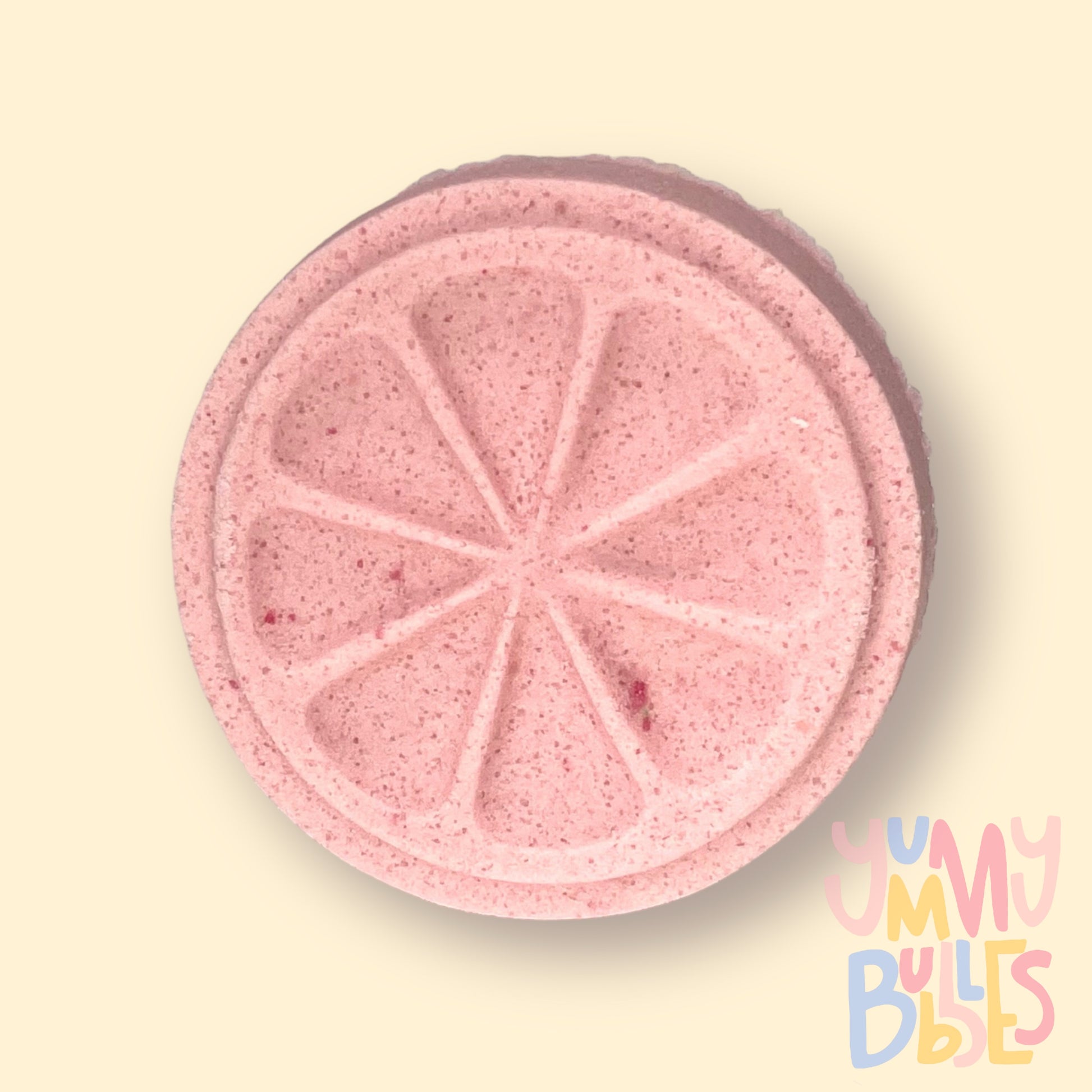 Pink circular citrus shaped shower bomb