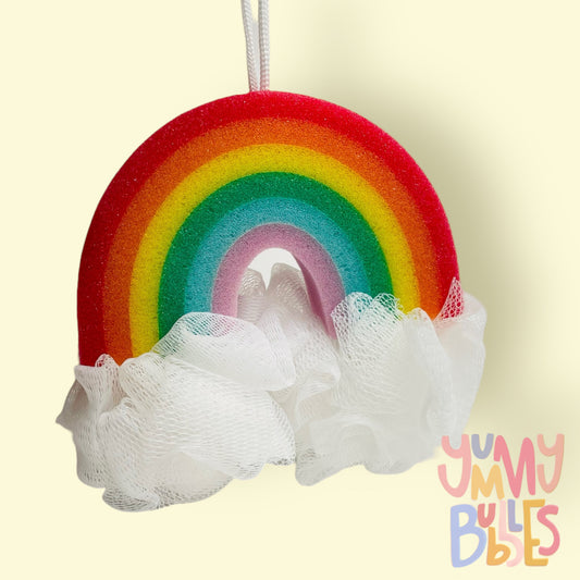 rainbow shaped sponge with fluffy cloud loofahs on each side. Rainbow sponge consists of red, orange, yellow, green, blue, and purple.