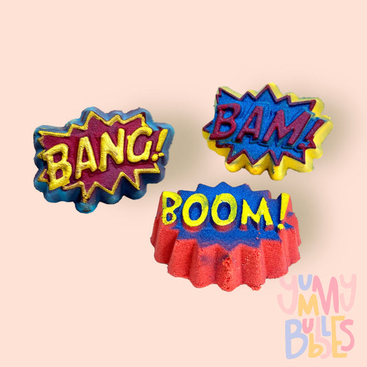 Set of 3 conversation stars with Bang, Bam, and boom. Consists of blue, yellow, and red bath bombs with the same color's used to paint the text
