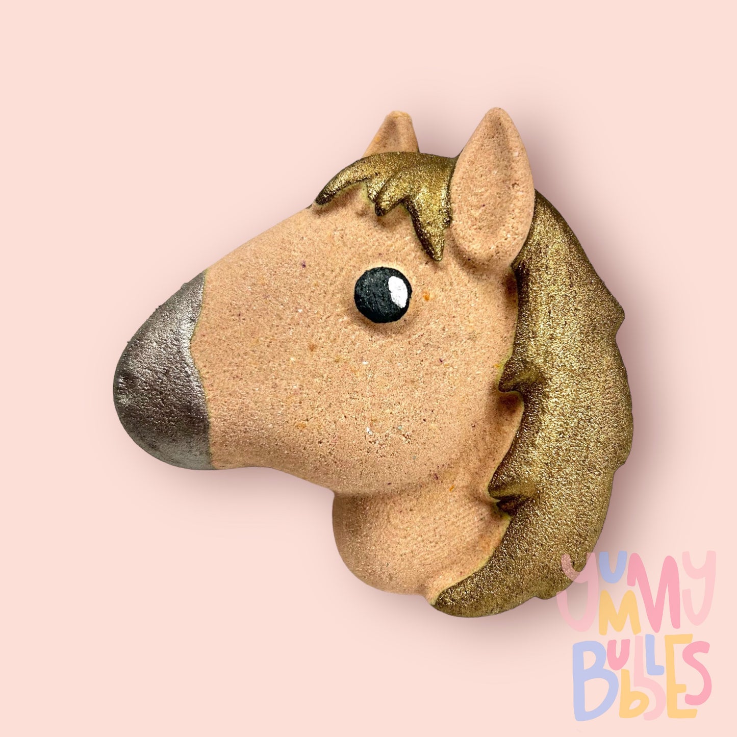 Brown horse head shaped bath bomb painted with brown, white, and black