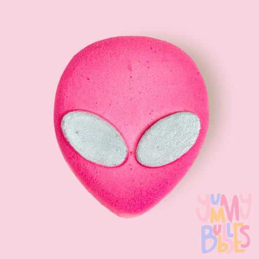 Pink alien shaped bath bomb with white eyes