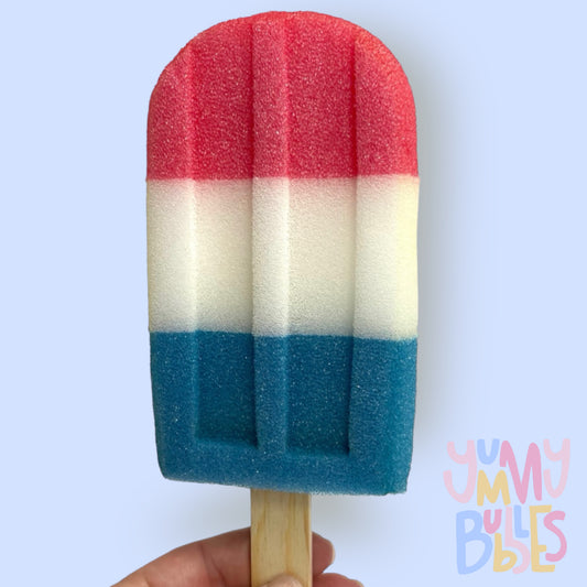 popsicle bath sponge in red white and blue on a stick