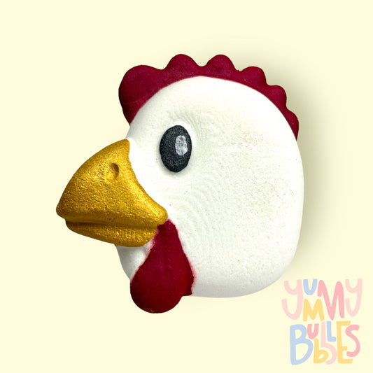 White chicken shaped chicken with red, yellow, black, and white paint