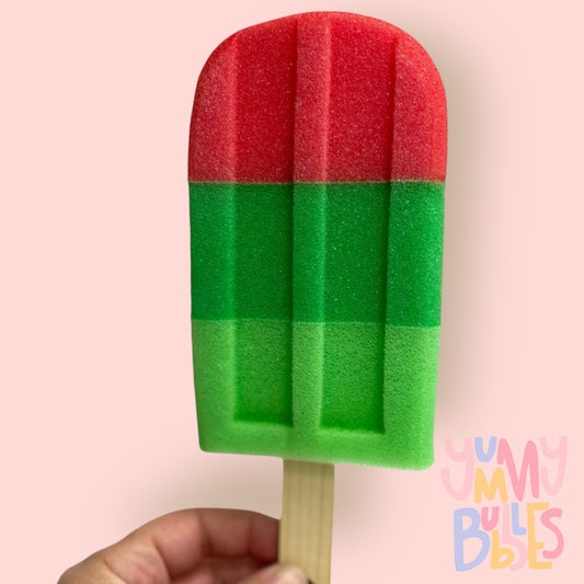 popsicle bath sponge in red and two shades of green on a stick