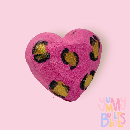 Pink Geometric heart shaped bath bomb with a painted leopard print design in gold and black