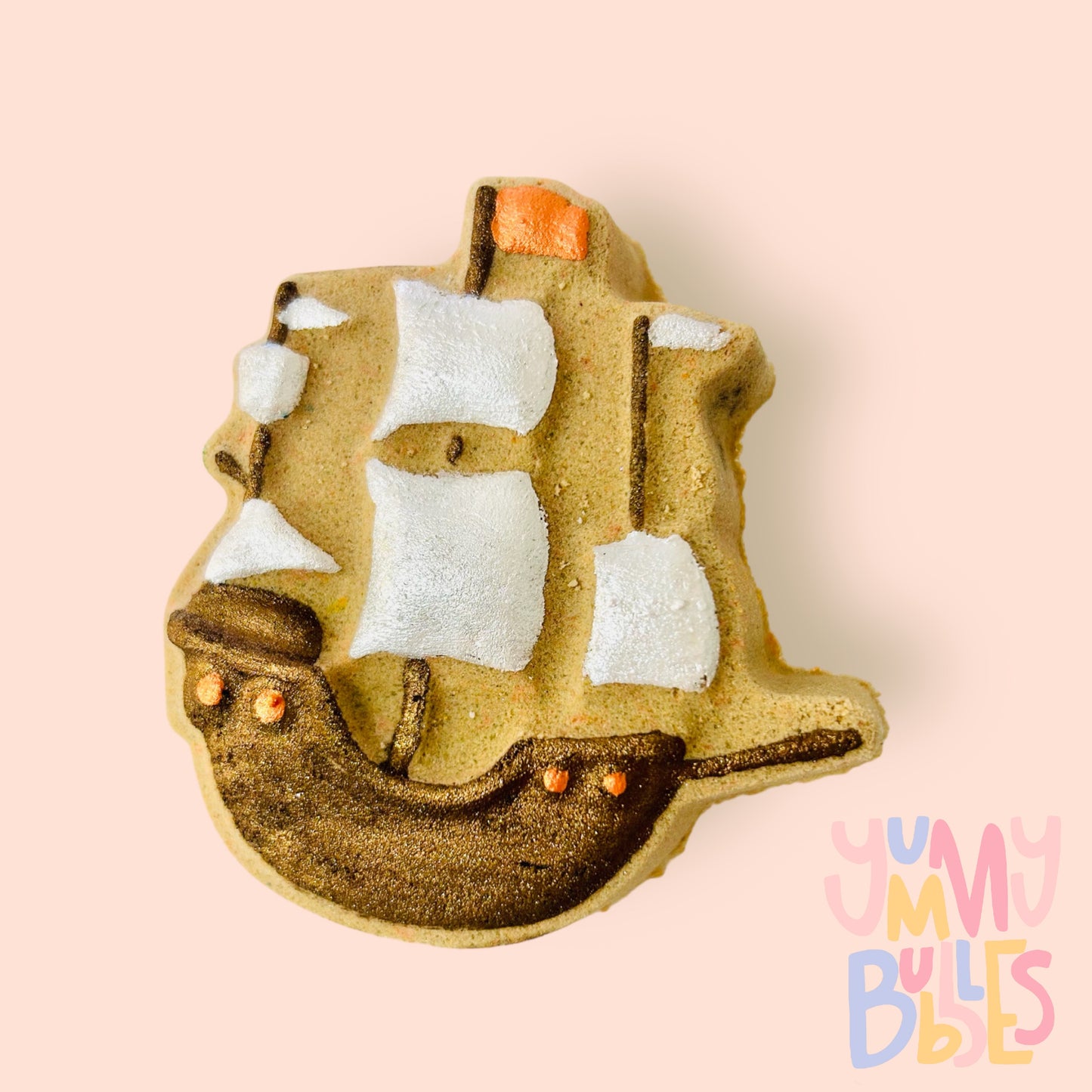 brown pirate ship shaped bath bomb with details painted in dark brown, orange, and white