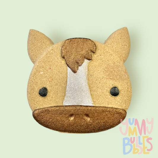 Brown horse shaped bath bomb painted with white, dark brown, and black