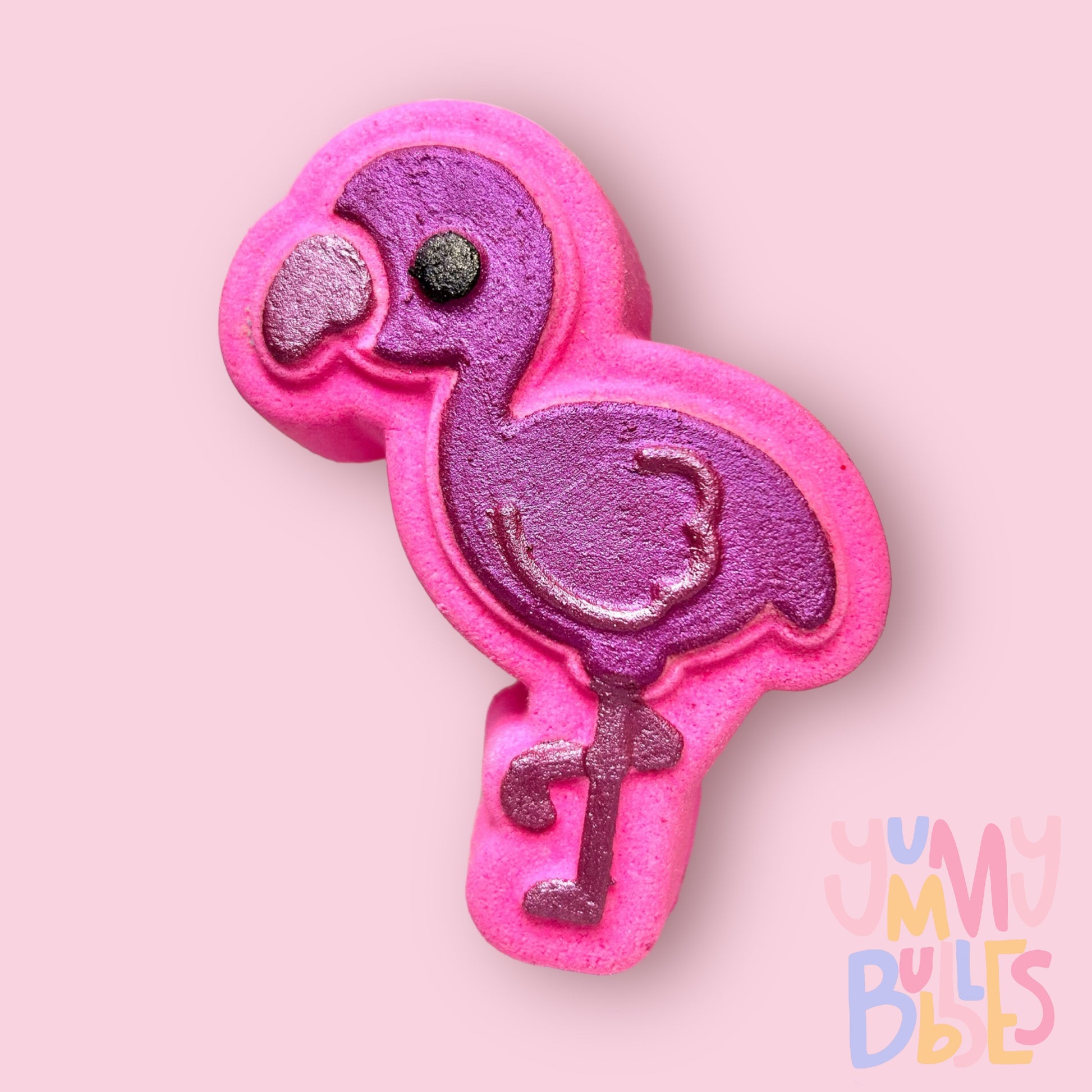 pink flamingo shaped bath bomb painted with dark and light pink