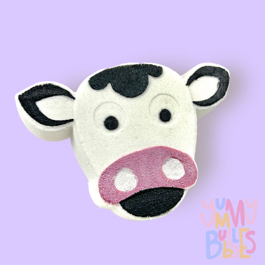 White cow shaped bath bomb with black and light pink paint