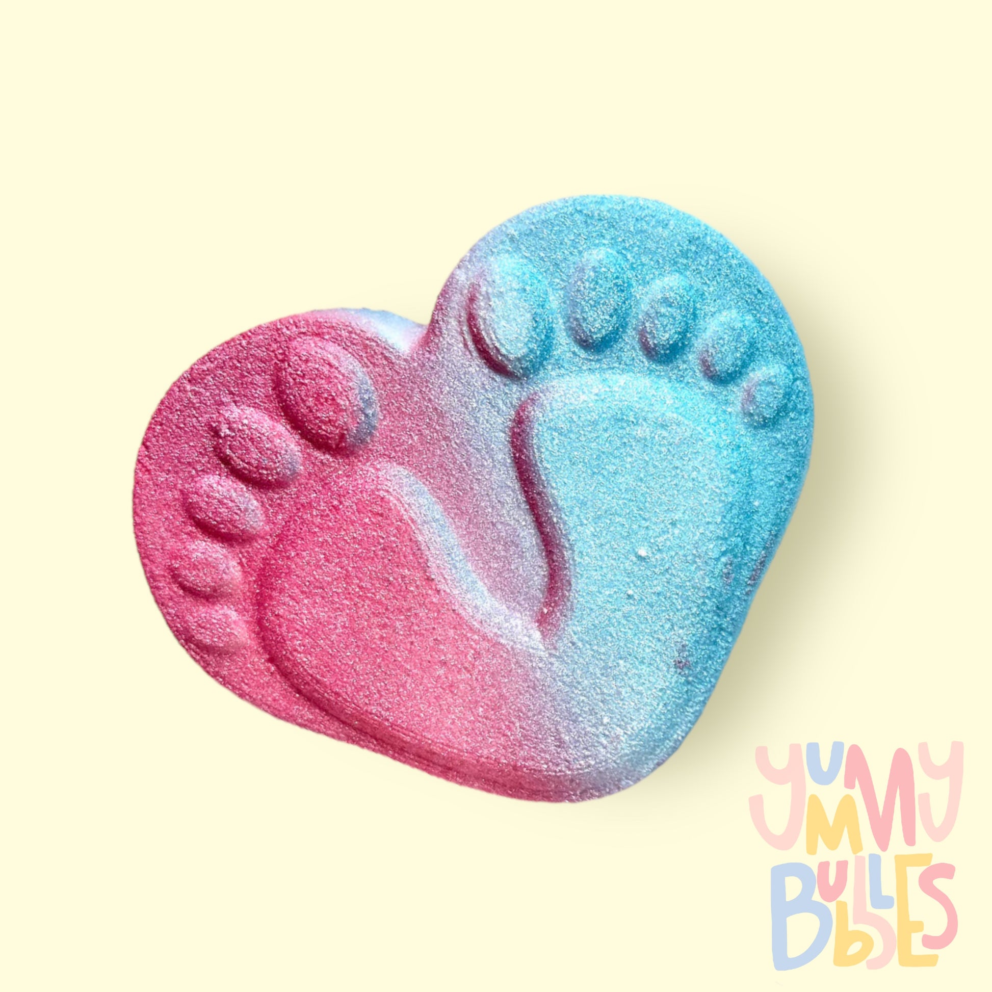Baby foot prints on heart shaped bath bomb, painted pink and blue on opposing sides