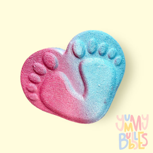Baby foot prints on heart shaped bath bomb, painted pink and blue on opposing sides