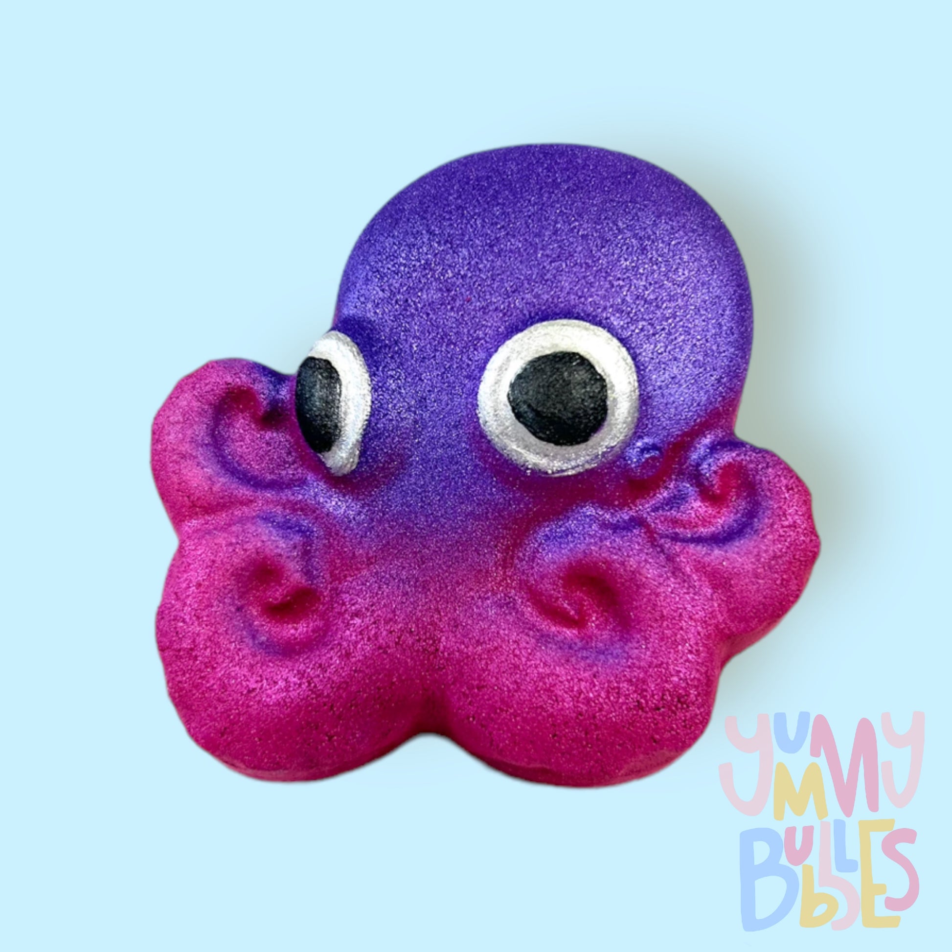 Octopus shaped bath bomb painted with a purple and pink gradient