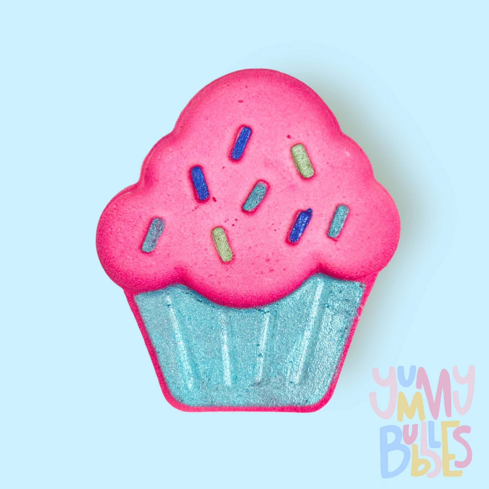 Pink cupcake shaped bath bomb painted with shades of blue and green