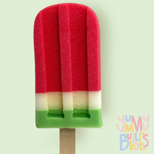watermelon themed popsicle sponge with red, white, and green layers on a stick