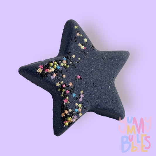 Black star shaped bath bomb with star and circular colored sprinkles