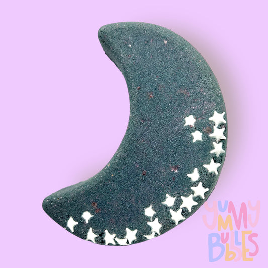 Black moon shaped bath bomb with white sprinkles