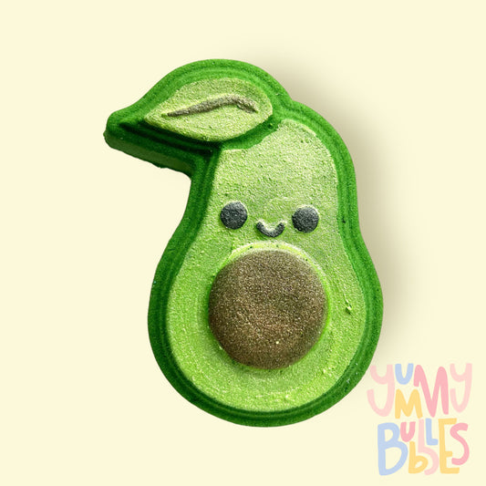 Green avocado shaped bath bomb painted with light green, brown, and black