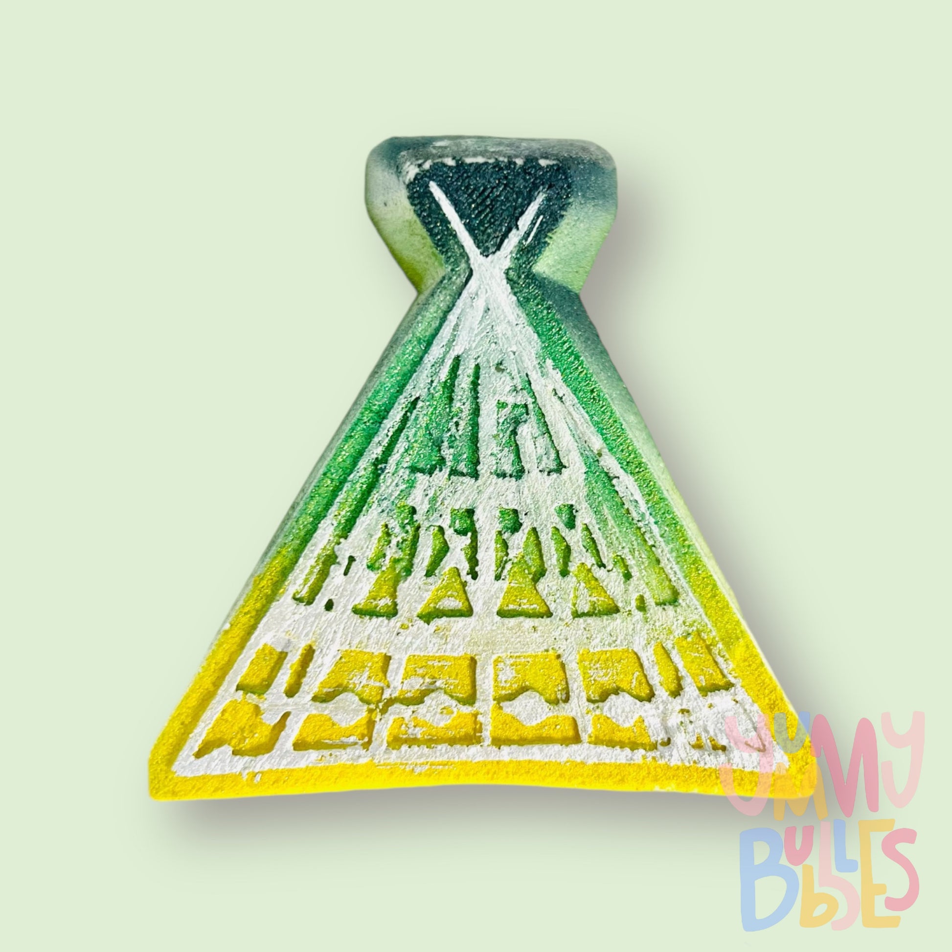 Medicine Hat teepee shaped bath bomb with a green to yellow gradient, painted with white to outline the teepee
