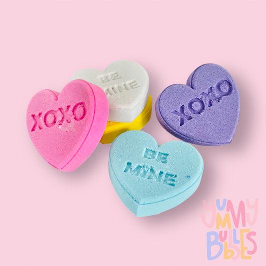 Set of ten variety candy gram shaped bath bombs with sweet messages such as xoxo, be mine, etc