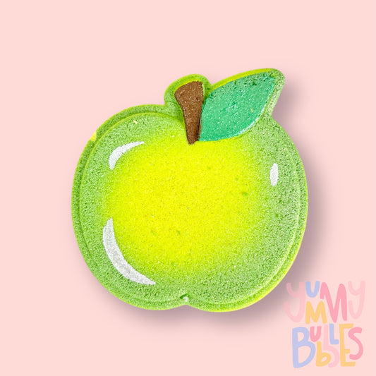 Green apple shaped bath bomb with white , green, and brown painted details