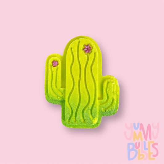 Green cactus shaped bath bomb with pink painted flowers and a green gradient base